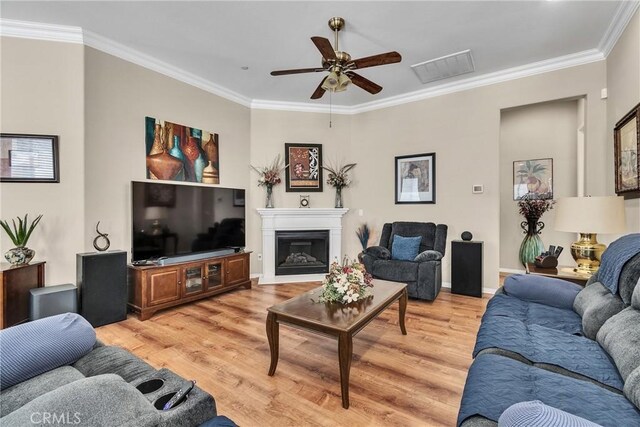455 Everest Peak, Beaumont, CA 92223 - living room featuring light wood-style floors, ceiling fan, and ornamental molding