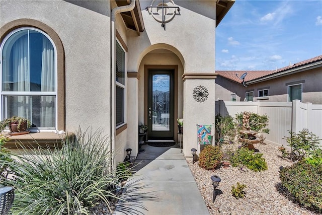 455 Everest Peak, Beaumont, CA 92223 - view of exterior entry with fence and stucco siding