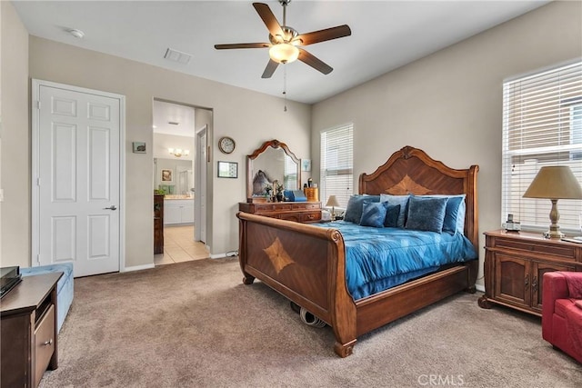 455 Everest Peak, Beaumont, CA 92223 - carpeted bedroom featuring ensuite bath, visible vents, baseboards, and a ceiling fan