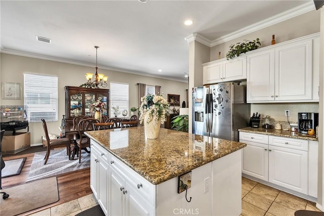 455 Everest Peak, Beaumont, CA 92223 - kitchen featuring crown molding, white cabinetry, and stainless steel fridge
