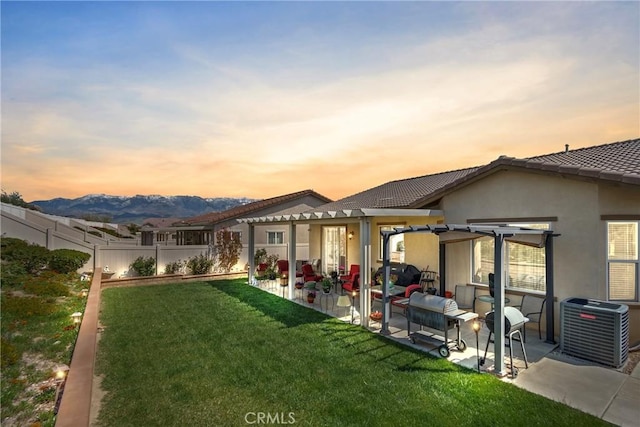 455 Everest Peak, Beaumont, CA 92223 - rear view of property with central AC, a patio area, a lawn, fence, and stucco siding