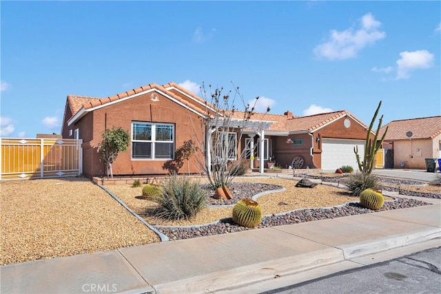 ranch-style home with driveway, fence, a tiled roof, an attached garage, and stucco siding