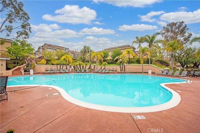 1041 S Positano Ave, Anaheim, CA 92808 - community pool with a patio, fence, and stairs