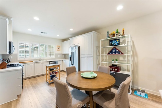 133 Lantana Dr, Stanton, CA 90680 - dining room featuring light wood-style flooring and recessed lighting