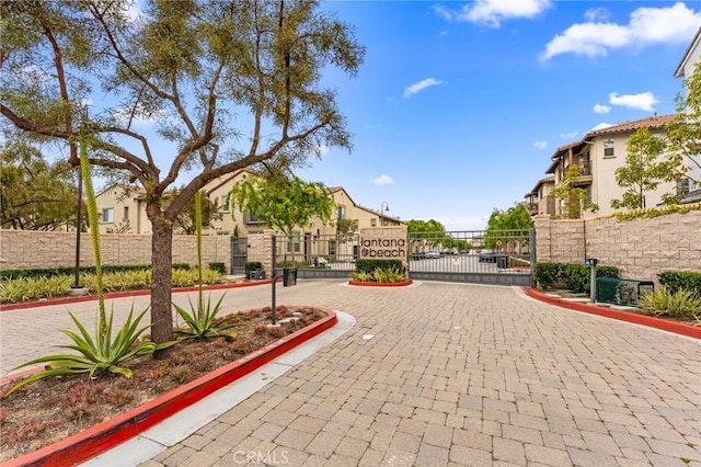 133 Lantana Dr, Stanton, CA 90680 - surrounding community featuring a gate and a residential view