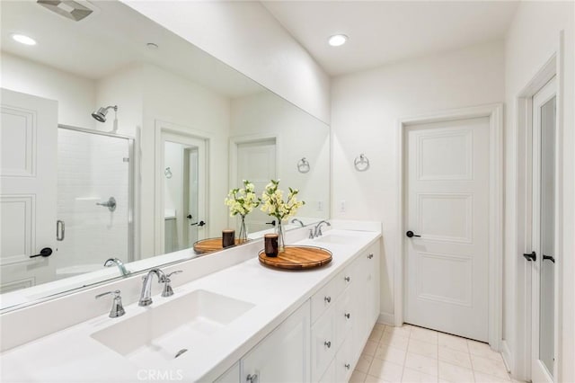 133 Lantana Dr, Stanton, CA 90680 - full bathroom featuring double vanity, a stall shower, tile patterned flooring, recessed lighting, and baseboards