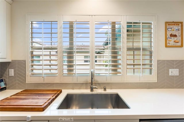 133 Lantana Dr, Stanton, CA 90680 - kitchen with a sink, backsplash, light countertops, and dishwashing machine