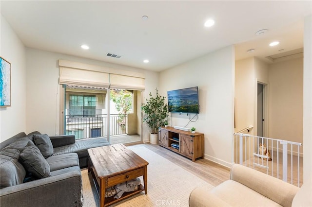 133 Lantana Dr, Stanton, CA 90680 - living room featuring wood finished floors, recessed lighting, and baseboards
