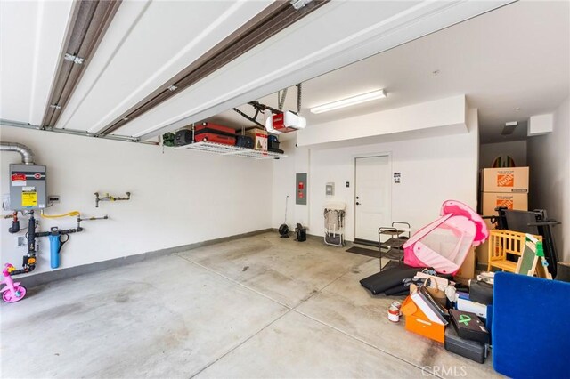 133 Lantana Dr, Stanton, CA 90680 - garage with electric panel and a garage door opener