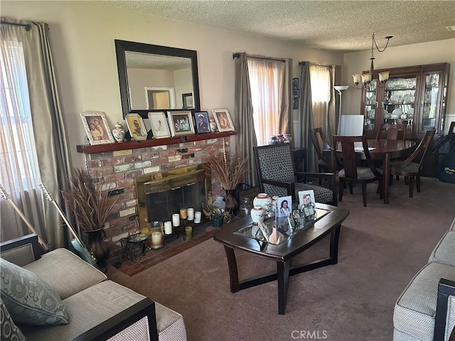 4908 W 109th St, Inglewood, CA 90304 - living room with carpet, a fireplace, a textured ceiling, and a chandelier