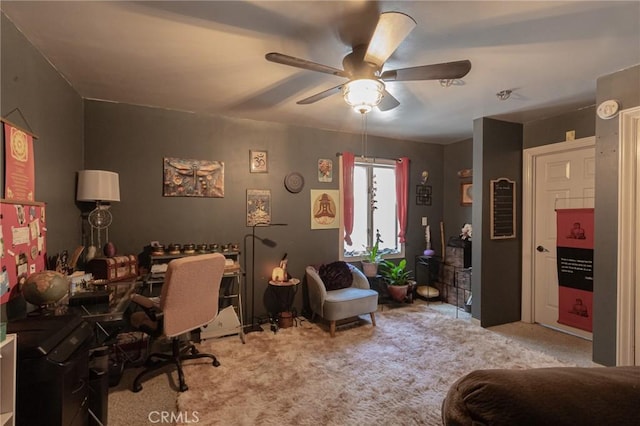 home office with carpet floors and ceiling fan