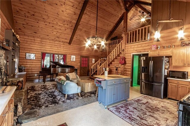 9408 Mill Dr, Forest Falls, CA 92339 - living room with high vaulted ceiling, rustic walls, and stairs