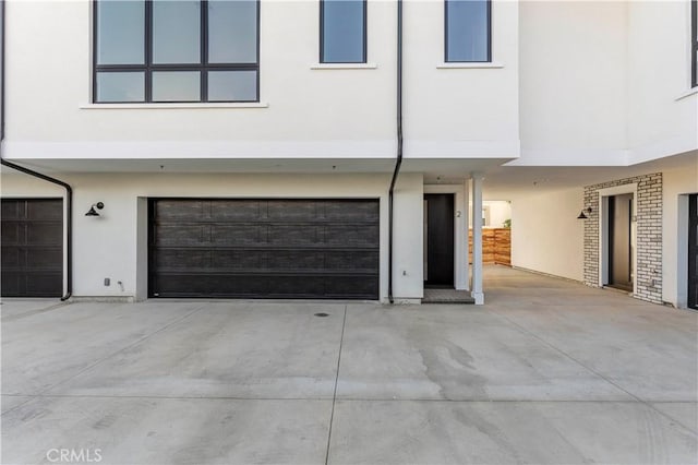 709 S 2nd Ave Unit 2, Arcadia, CA 91006 - view of front of house featuring stucco siding, an attached garage, a carport, and concrete driveway