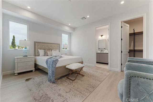 709 S 2nd Ave Unit 2, Arcadia, CA 91006 - bedroom with light wood finished floors, recessed lighting, baseboards, and ensuite bath