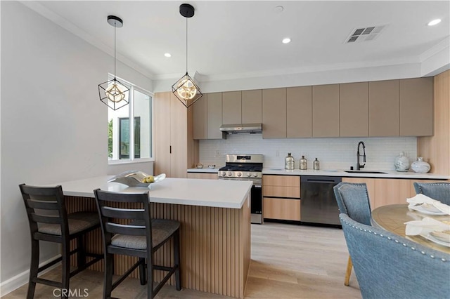 709 S 2nd Ave Unit 2, Arcadia, CA 91006 - kitchen featuring dishwashing machine, stainless steel gas range oven, under cabinet range hood, a sink, and crown molding