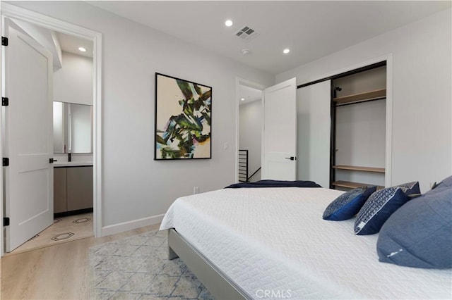 709 S 2nd Ave Unit 2, Arcadia, CA 91006 - bedroom with light wood-type flooring, recessed lighting, a closet, baseboards, and connected bathroom