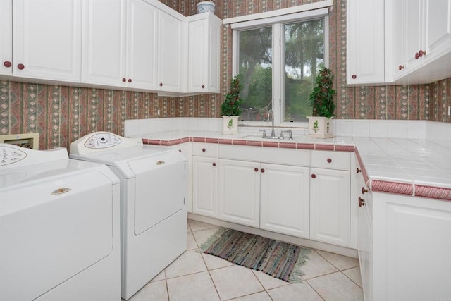 13645 Paseo De La Huerta, Poway, CA 92064 - laundry room with wallpapered walls, washer and dryer, cabinet space, and light tile patterned flooring