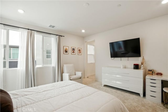 bedroom featuring recessed lighting, visible vents, and light carpet