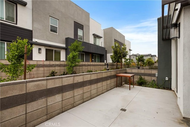 view of patio / terrace featuring fence