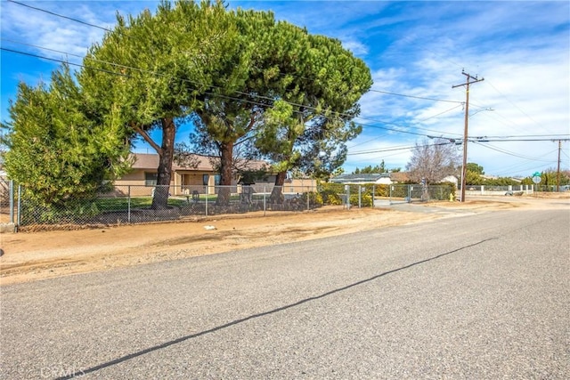 ranch-style home featuring fence