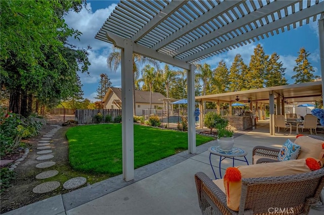 view of patio / terrace with area for grilling, a pergola, and a fenced backyard