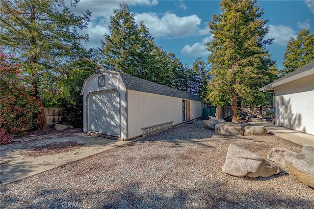 view of shed with fence