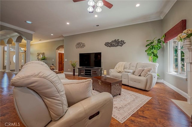 living room featuring ornate columns, recessed lighting, a ceiling fan, and arched walkways