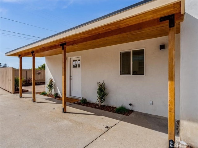1912 8th St, Los Osos, CA 93402 - property entrance with fence, a patio area, and stucco siding