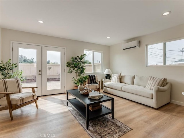 1912 8th St, Los Osos, CA 93402 - living room with french doors, light wood-style flooring, recessed lighting, baseboards, and a wall unit AC