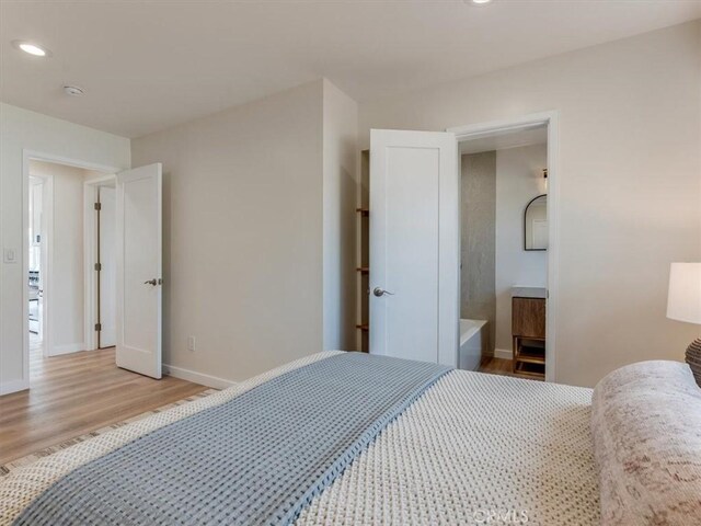 1912 8th St, Los Osos, CA 93402 - bedroom with light wood finished floors and recessed lighting
