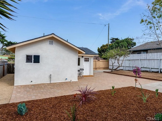 1912 8th St, Los Osos, CA 93402 - rear view of house featuring a fenced backyard, a patio area, and stucco siding