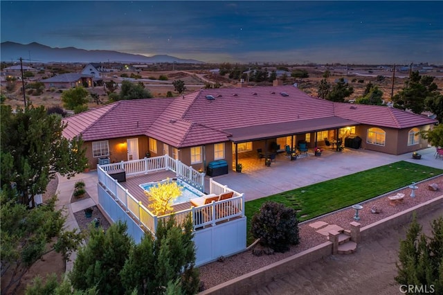 birds eye view of property with a mountain view