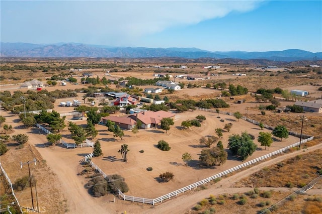 birds eye view of property with a mountain view, view of desert, and a rural view