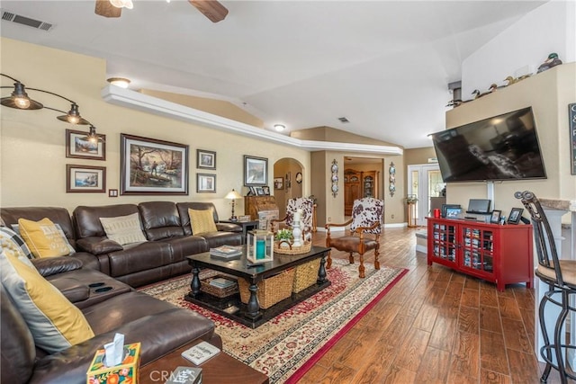 living room featuring visible vents, baseboards, ceiling fan, dark wood-type flooring, and lofted ceiling