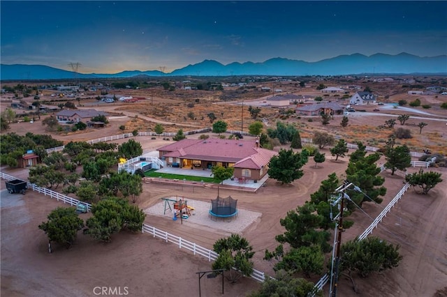 birds eye view of property featuring a mountain view