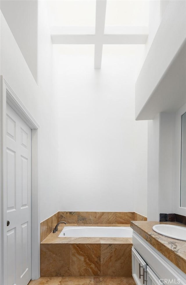 bathroom featuring a bath and vanity