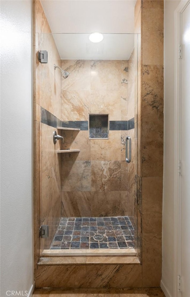full bathroom featuring a stall shower