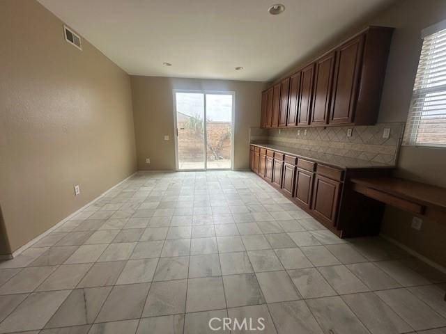 2420 Lenai Cir, Corona, CA 92879 - kitchen featuring plenty of natural light and backsplash