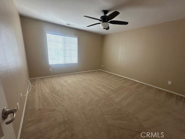 2420 Lenai Cir, Corona, CA 92879 - carpeted spare room with baseboards and a ceiling fan
