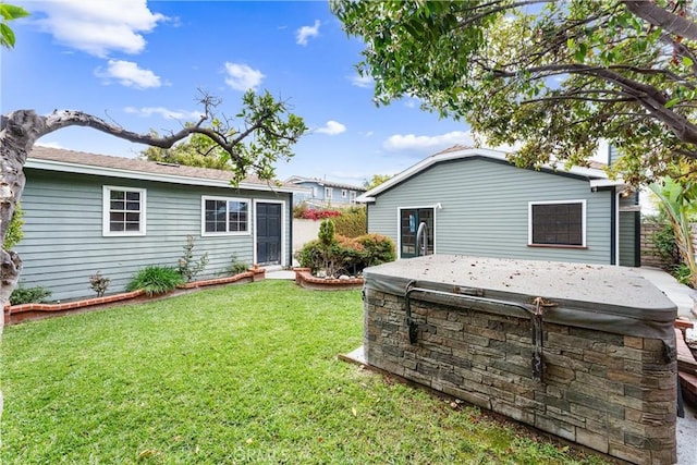 back of house with a yard