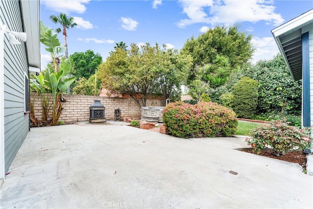 view of patio featuring fence