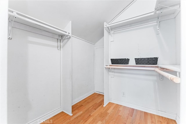 walk in closet featuring light wood-style flooring