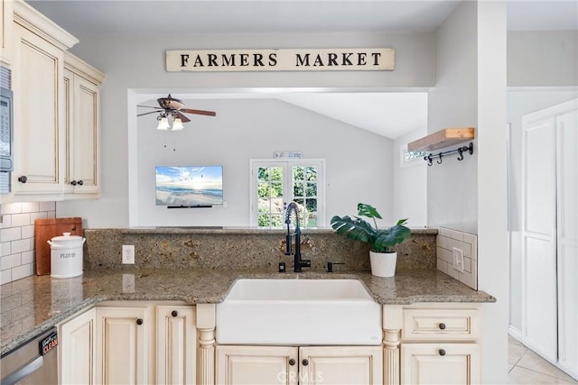 kitchen with light stone counters, a sink, a ceiling fan, dishwasher, and decorative backsplash