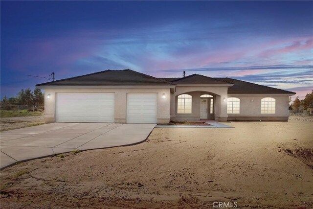 17796 Valencia St, Hesperia, CA 92345 - single story home featuring an attached garage, stucco siding, driveway, and a tiled roof