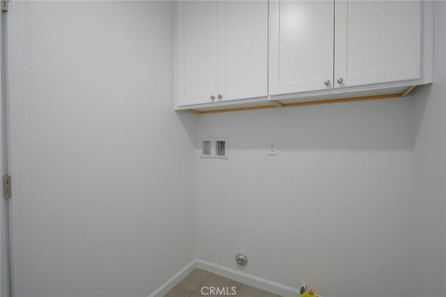 17796 Valencia St, Hesperia, CA 92345 - washroom with cabinet space, baseboards, hookup for a washing machine, light tile patterned floors, and gas dryer hookup