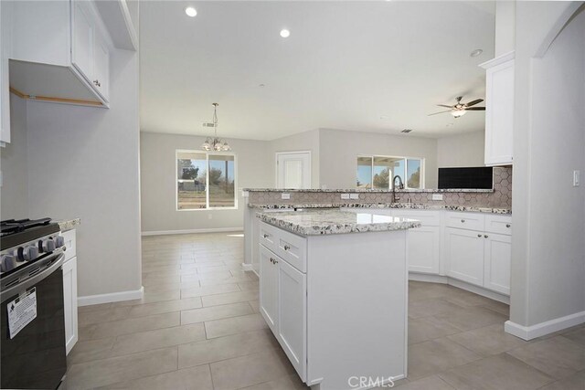 17796 Valencia St, Hesperia, CA 92345 - kitchen with gas range, backsplash, a ceiling fan, plenty of natural light, and recessed lighting