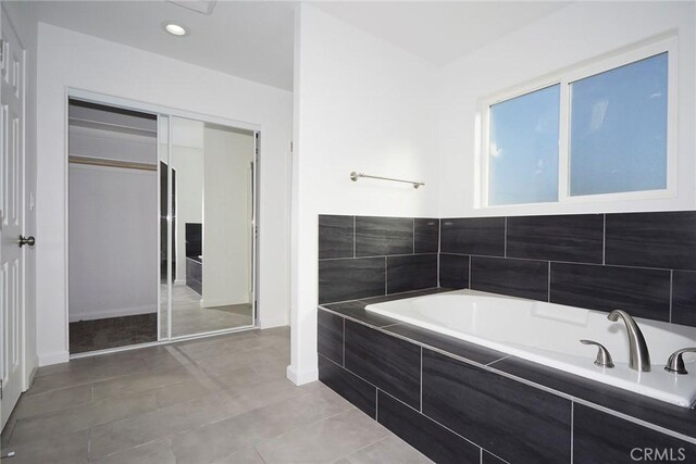 17796 Valencia St, Hesperia, CA 92345 - bathroom with a bath, baseboards, tile patterned floors, and recessed lighting