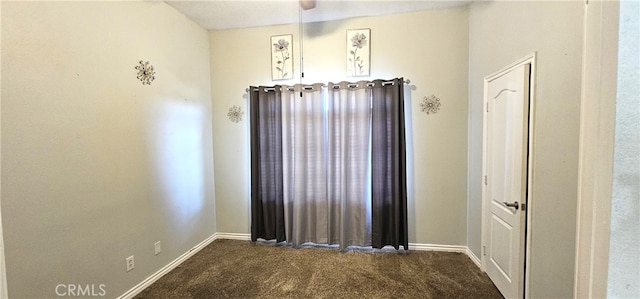 7445 Cedar St, Phelan, CA 92371 - spare room featuring dark colored carpet and baseboards