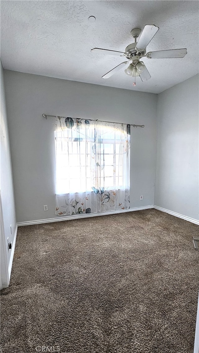 7445 Cedar St, Phelan, CA 92371 - unfurnished room featuring baseboards, a ceiling fan, and carpet flooring