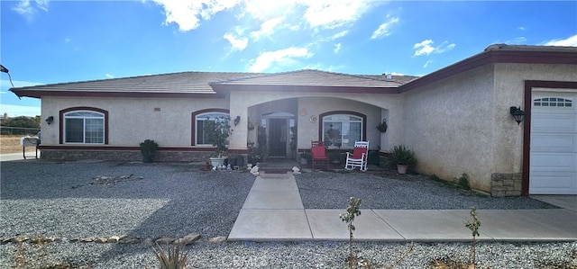 7445 Cedar St, Phelan, CA 92371 - property entrance with stucco siding and an attached garage